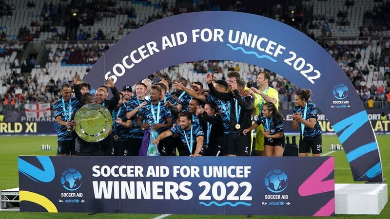 Rest of the World XI players celebrate with the trophy after the Soccer Aid for UNICEF match at The London Stadium (Zac Goodwin/PA)