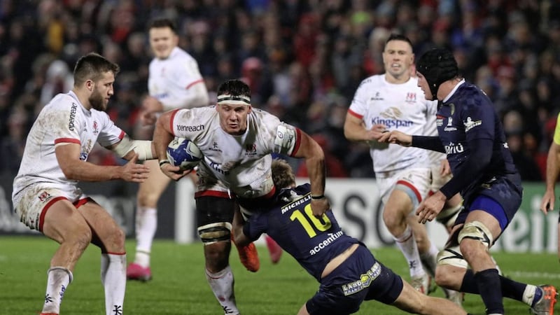 Ulster Rugby&#39;s Marcell Coetzee (centre) is tackled down by Clermont Auvergne&#39;s Jake McIntyre during a Heineken Champions Cup Round 2 match at the Kingspan Stadium, Belfast. 