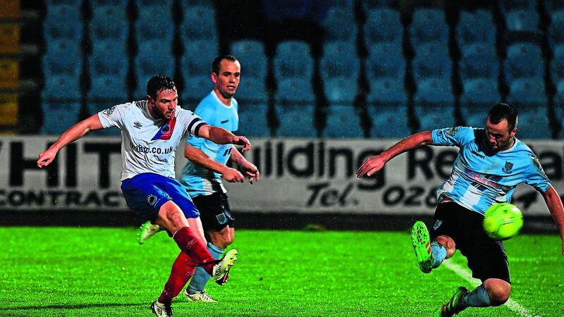 Jamie Mulgrew scores Linfield&rsquo;s fourth goal in their 4-1 win over Ballymena in midweek. The victory moved David Healy&rsquo;s men to within four points of legue leaders Crusaders, who were held by Glenavon on the same night. Picture by Pacemaker