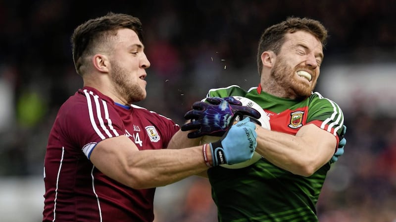 Chris Barrett of Mayo in action against Damien Comer of Galway during the Connacht Senior Championship semi-final match between Galway and Mayo at Pearse Stadium, in Salthill Picture by Ray McManus/Sportsfile 