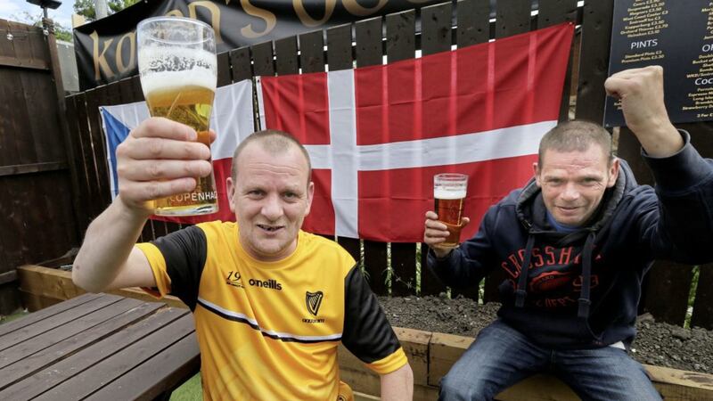 Brothers Sean and Paul Smith enjoy a pint in Karen&#39;s beer garden in Fitzpatrick&#39;s Bar in north Belfast. Picture by Hugh Russell. 