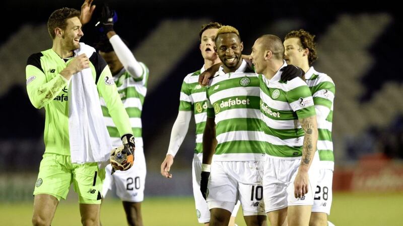 Celtic&#39;s Moussa Dembele (10) celebrates victory with Scott Brown and goalkeeper Craig Gordon after the Ladbrokes Scottish Premiership match at the Tulloch Caledonian Stadium, Inverness on Wednesday March 1, 2017 