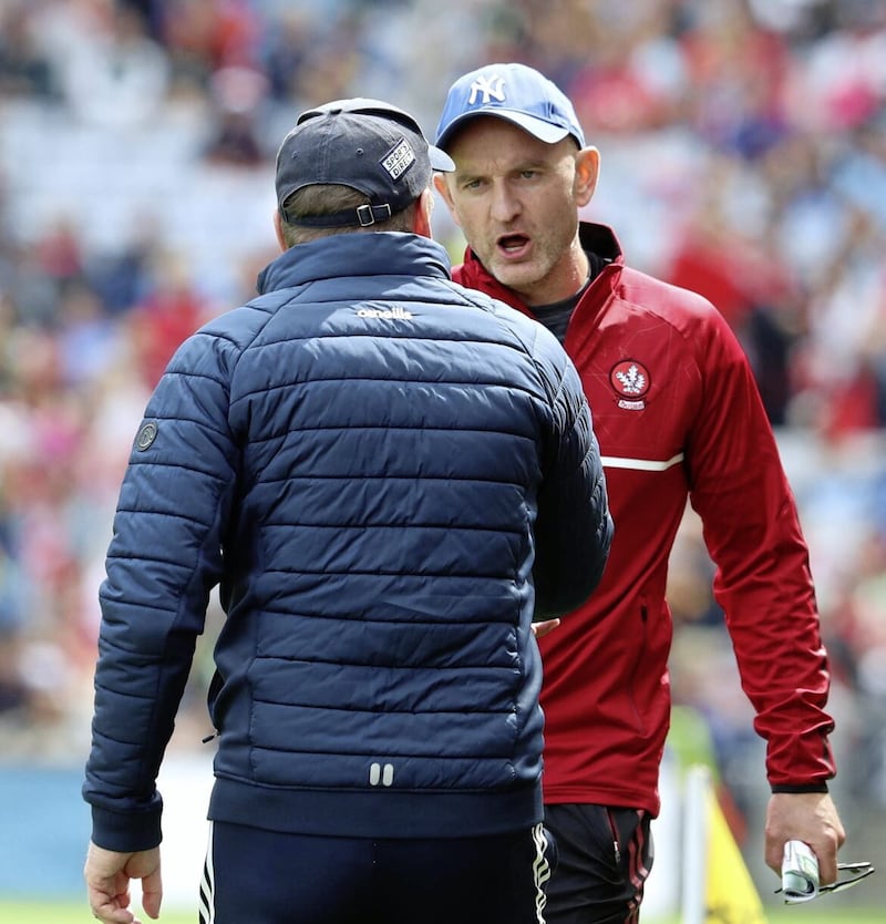 Derry boss Ciar&aacute;n Meenagh commiserates with Cork&#39;s John Cleary at the end of yesterday&#39;s All-Ireland quarter-final at Croke Park Picture: Philip Walsh 