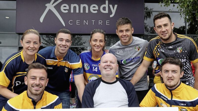 Past and present Antrim GAA stars pictured with former football captain Anto Finnegan. (Back row L-R) Emma Kelly, Matthew Fitzpatrick, Jane Adams, Patrick McBride and Conor Murray. (Front row l-r) Declan Lynch, Anto Finnegan and Conor McKinley ready for this Sunday&#39;s &#39;Run For Anto&#39; 