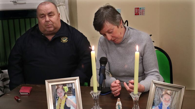 Parishioners lead the prayers at Kickhams Creggan GAC club for brother and sister Fintan (14) and sister Mary (11) O'Neill (pictured in frames) who were both knocked down after getting off a school bus.&nbsp;Picture by Declan Roughan