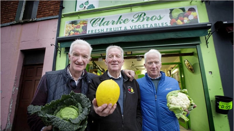 The Clarke brothers at their fruit and vegetables shop on its last day serving west Belfast. Picture by Hugh Russell 