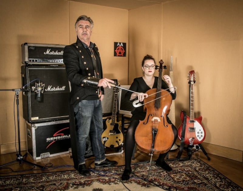 Former Sex Pistols bassist Glen Matlock with cellist Hen Titcombe at the launch of The Anarchy Arias album where the Royal Philharmonic Orchestra collaborated with opera singers to record an album of punk tunes. (Universal Music/Press Association Images)