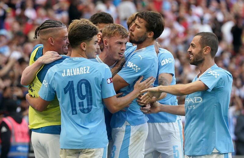 Manchester City’s Cole Palmer (centre) celebrates with team-mates 