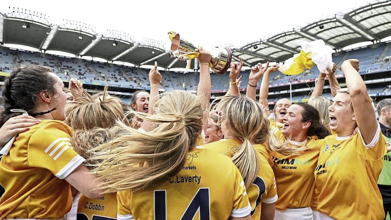 Antrim players celebrate after the game with the trophy after their All-Ireland Intermediate Championship final win over Kilkenny at Croke Park<br /><br />Picture: INPHO/Laszlo Geczo