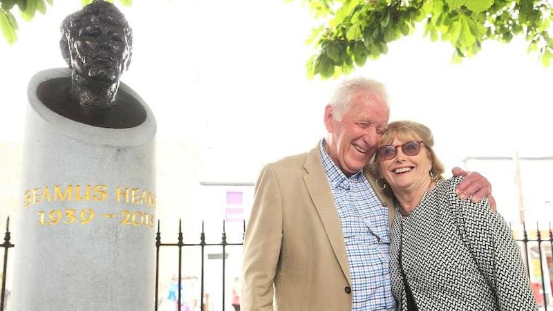 Marie Heaney and her brother-in-law Hugh Heaney attend the unveiling of a bust in honour of her late husband on Sandymount Green, Dublin. Picture by Brian Lawless, Press Association 