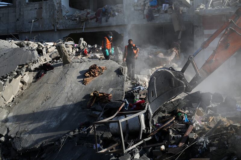 Palestinians search for survivors after Israeli strikes (Hatem Ali/AP)