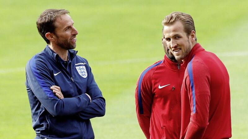 England manager Gareth Southgate and captain Harry Kane have a chat during a training session yesterday Picture by PA 