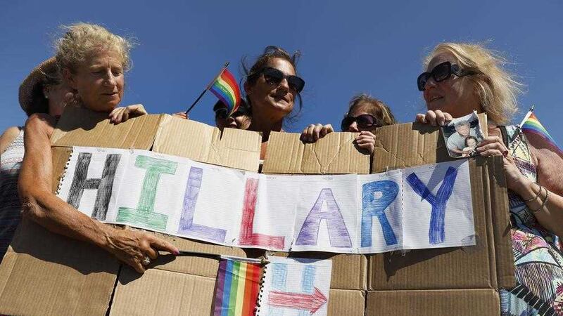 The four &quot;Smith Sisters&quot; from New York state hold a sign they made supporting Democratic presidential candidate Hillary Clinton outside the gate of Provincetown Municipal Airport in Provincetown, Massachusetts. Picture by Carolyn Kaster, Associated Press