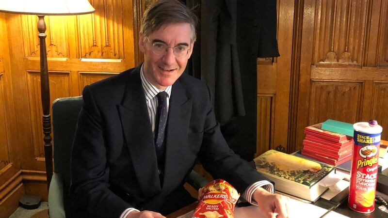 The Conservative MP appeared in his study with a packet of Walkers and a tube of Pringles, reassuring crisp-makers they were in ‘no danger’.