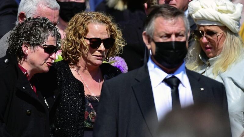 Geraldine Mullan was comforted by family members at the funerals of her husband and two children. PICTURE: Colm Lenaghan/Pacemaker. 