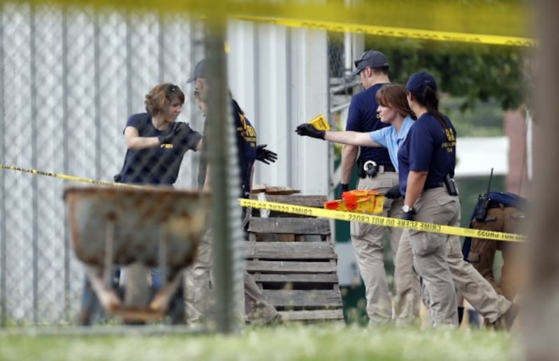 investigators on the scene of the shooting (Alex Brandon/AP)