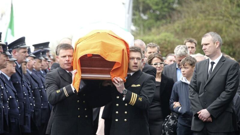 The coffin of Captain Mark Duffy is carried into St Oliver Plunkett Church in Blackrock, after he died when the Irish Coast Guard helicopter crashed off the coast of Co Mayo earlier this month Picture by Niall Carson/PA 