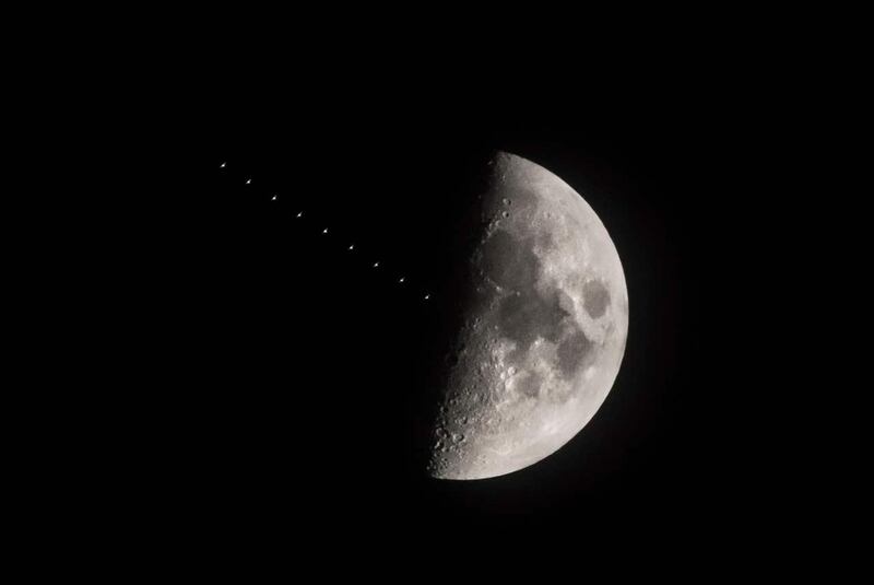 Multiple exposure created in camera showing the International Space Station transiting the first quarter moon above Leeds (Danny Lawson/PA)