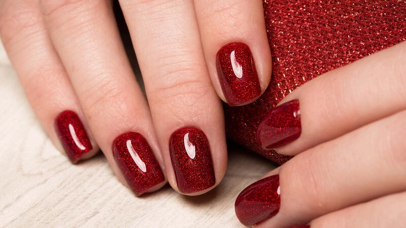 Nail your Christmas party look with a rich rouge shade (Alamy/PA)