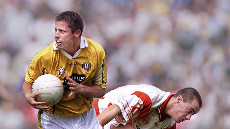 Antrim&#39;s Gear&oacute;id Adams leaves Tyrone&#39;s Brian McGuigan in his wake in an Ulster Championship at Casement Park. Picture: Ann McManus 