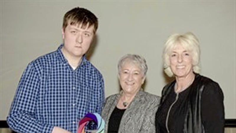 Award winning Belfast Met student Sam McGarrigle, Kate Fleck Chair of OCN NI and head of the college&#39;s school of Health, Wellbeing and Inclusion Sharon Rivers. 