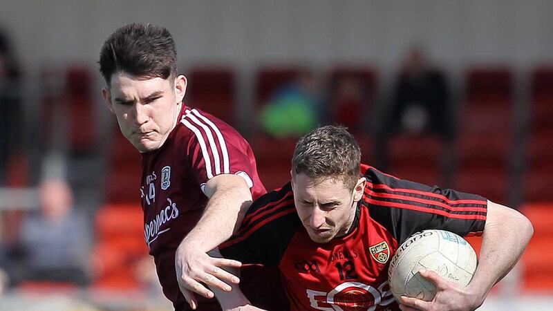 Down's Joe Murphy holds off Galway's Barry McHugh at Pairc Esler <br />&nbsp;