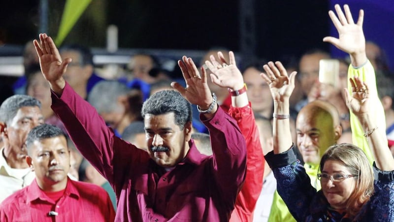 Venezuela&#39;s President Nicolas Maduro and his wife Cilia Flores pictured last year 