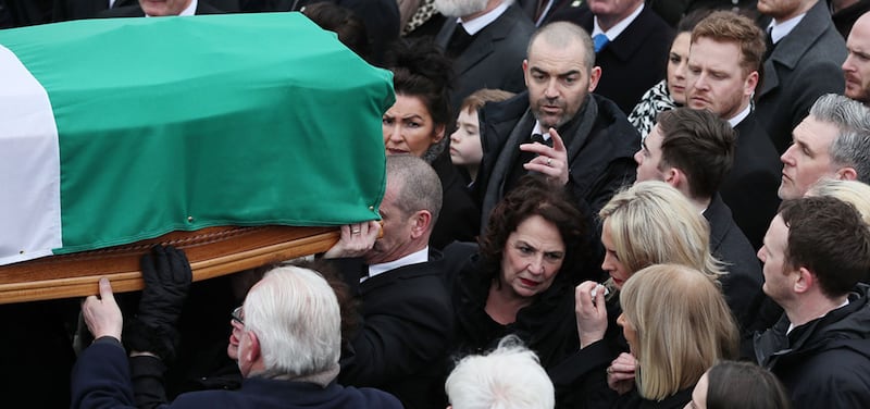 Martin McGuinness's wife Bernie (centre) follows his coffin is it arrives at St Columba's Church Long Tower, in Derry&nbsp;