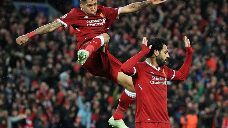 Liverpool's Mohamed Salah (right) celebrates scoring his side's second goal of the game with Roberto Firmino during the UEFA Champions League, semi-final first leg match at Anfield, Liverpool&nbsp;