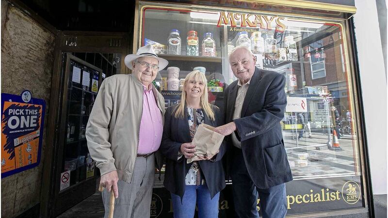 Brothers Sean (left) and Henry (right) McKay, who set up McKay's Confectionary in Belfast city centre in 1976 with Natalie McKay (centre), who took over the family business 22 years ago. Picture by Hugh Russell.