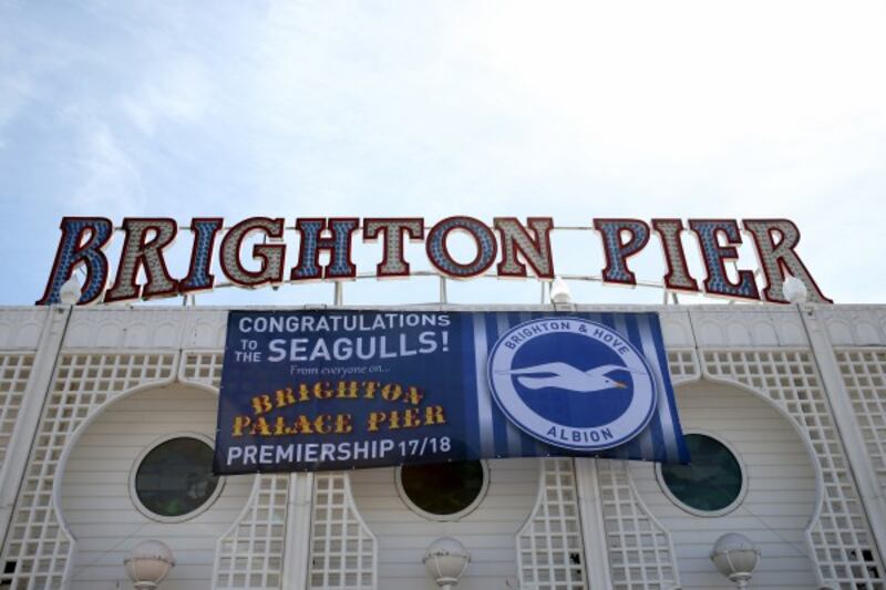 Brighton Pier celebrates Brighton & Hove Albion's promotion to the Premier League
