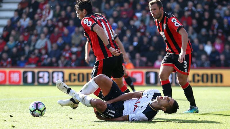 Tottenham Hotspur's Erik Lamela goes to ground after a challenge by Bournemouth's Charlie Daniels during Saturday's Premier League match at the Vitality Stadium<br />Picture by PA