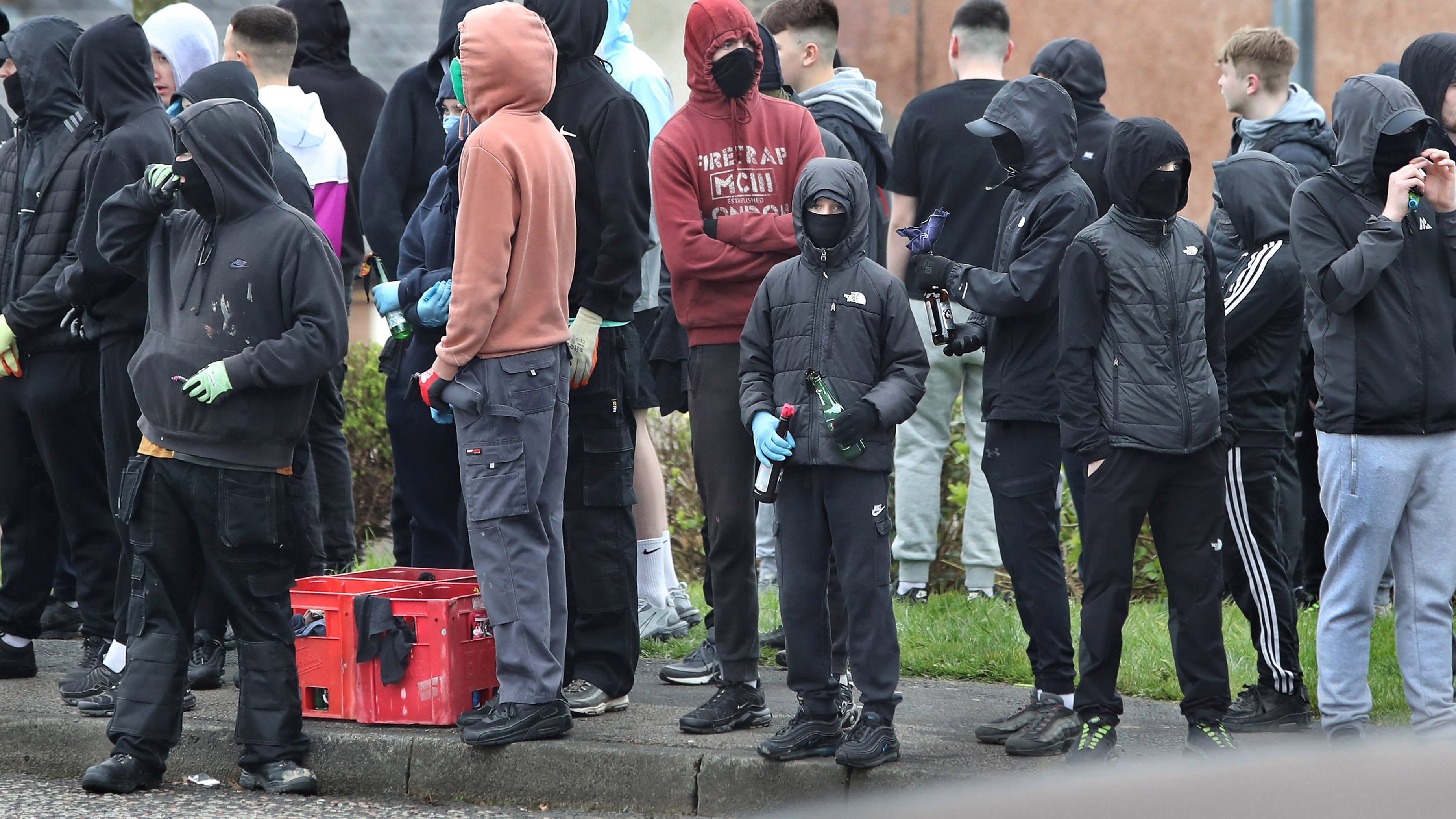 Youths carried crates of petrol bombs and concrete blocks during the Easter Monday dissident republican parade through the Creggan estate to the City Cemetery in Derry. NO BYLINE /  1-4-2024 MML