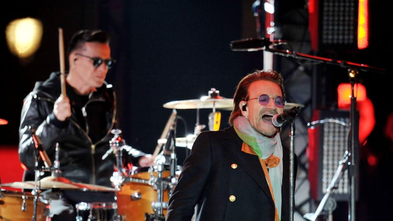 Larry Mullen Jr on the drums and Bono of U2 perform in Trafalgar Square, London (Nick Ansell/PA)