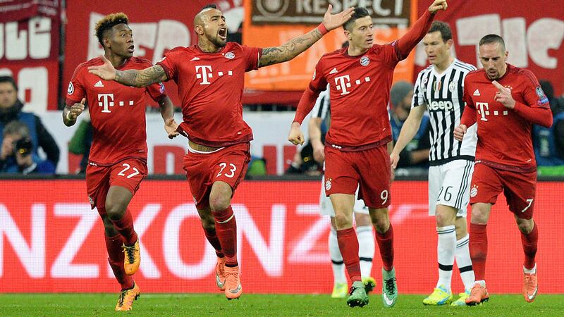 Bayern's Robert Lewandowski, (2nd right) celebrates his side's first goal during the Champion's League (AP Photo)