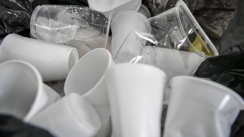 Disposable drinking cups in a bin (Ben Birchall/PA)