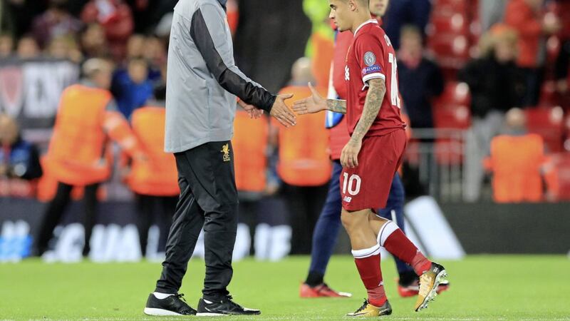 Liverpool manager Jurgen Klopp and Philippe Coutinho after the Uefa Champions League, Group E match at Anfield which ended 2-2 