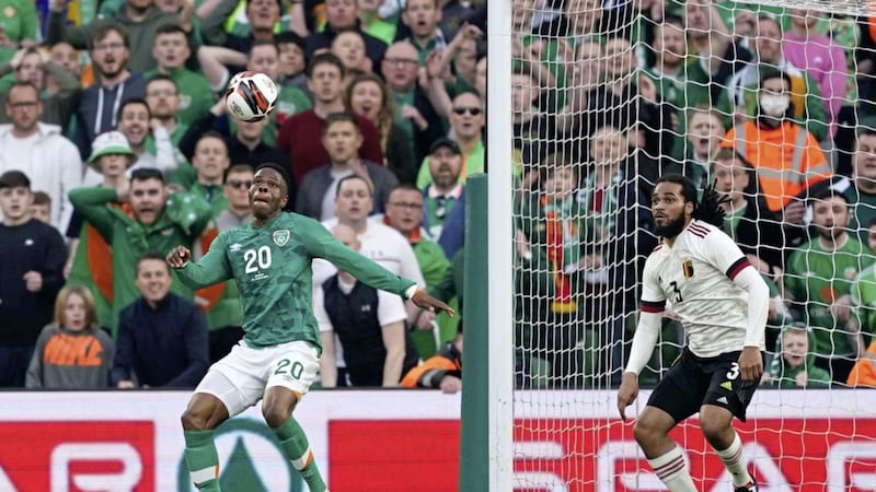 Ireland&#39;s Chiedozie Ogbene (left) scores their side&#39;s first goal of the game against Belgium 