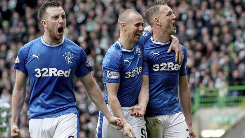 Rangers' Clint Hill (right) celebrates his late equaliser against runaway Scottish Premiership leaders Celtic at Celtic Park on Sunday.