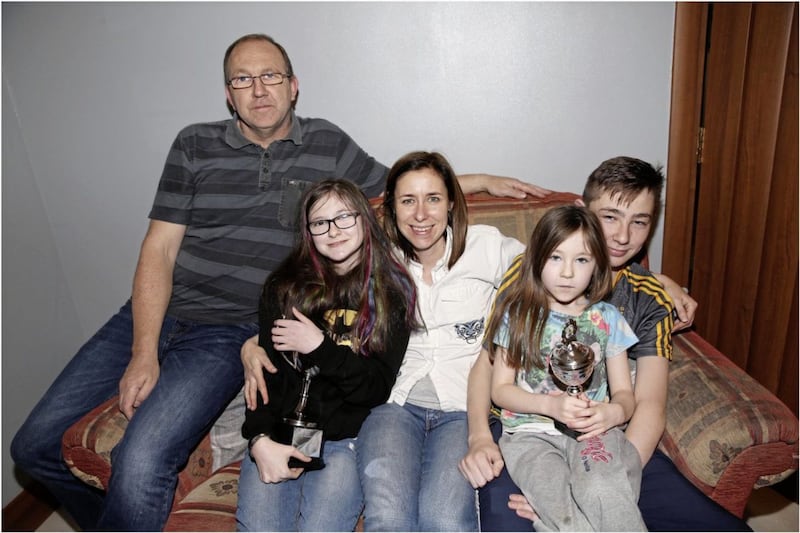 Mary and Fintan O&#39;Neill pictured with their father, Kevin, mother, Amelia and little sister, Katie one year on after the pair suffered a catalogue of injuries when they were knocked down by a car getting off a school bus in Co Antrim. Photo by Hugh Russell 
