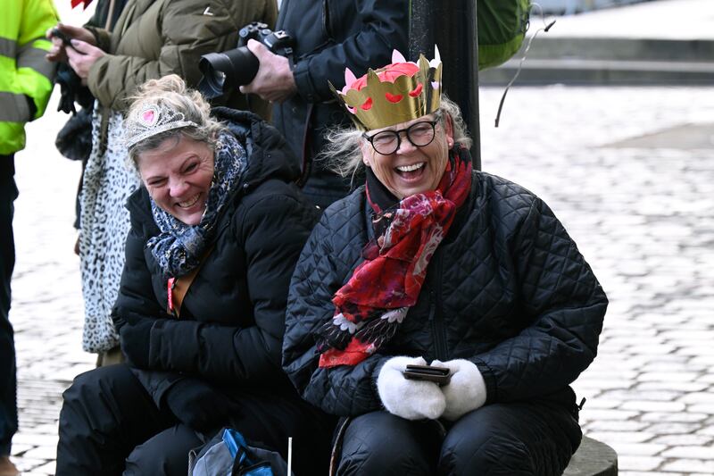 Susanne and Anette from Broendby wait for the royal procession at Christiansborg Slotsplads (Nils Meilvang./Ritzau Scanpix via AP)