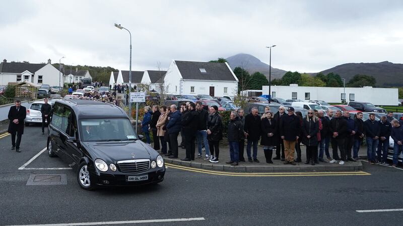 The hearse carrying Martin McGill, 49, arrives at St Michael's Church, Creeslough, for his funeral Mass. Picture by Niall Carson/PA Wire