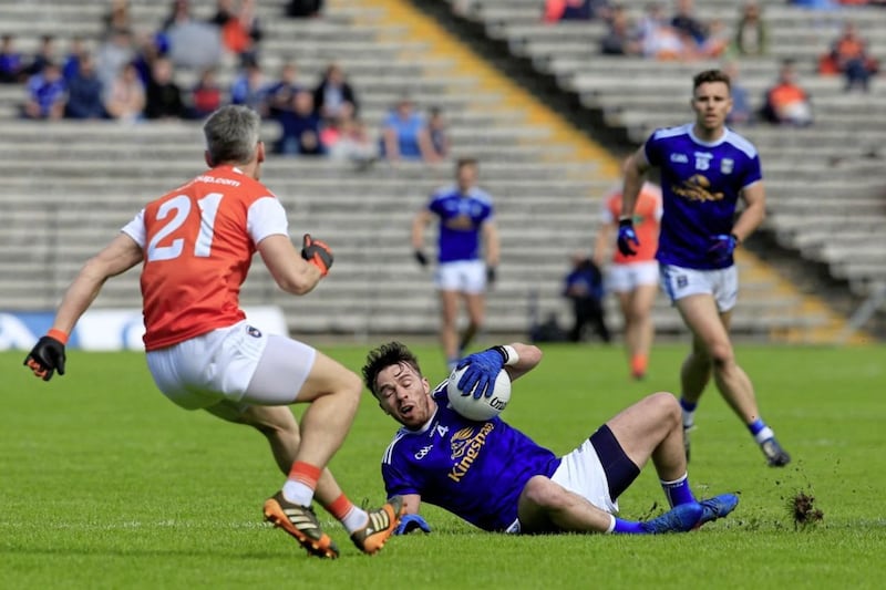 Cavan's Conor Moynagh and Armagh's Mark Shields in action during the Ulster Senior Football Championship semi-final.<br /> Picture by Philip Walsh.