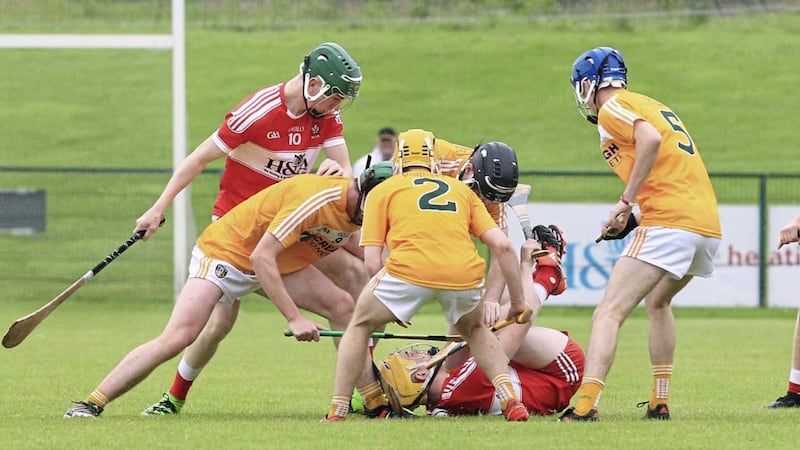 Antrim players Conor McHugh, Manus Smith, Fred McCurry and Ryan McGarry pile the pressure on Derry&#39;s Declan Quinn during the Ulster SHC final earlier this month. Picture by Margaret McLaughlin 