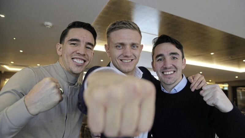 Kurt Walker (centre) signed with Mick and Jamie Conlan&#39;s Conlan Boxing stable. Picture by Hugh Russell. 