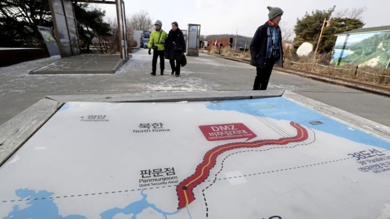 Visitors walk by a map of two Koreas showing North Korea&#39;s capital Pyongyang and South Korea&#39;s capital Seoul at the Imjingak Pavilion in Paju, South Korea PICTURE: Lee Jin-man/AP 