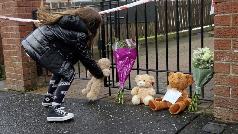Floral tributes and teddy bears with messages left outside the home where two children were stabbed in Brompton Park in Ardoyne. Picture by Mal McCann 