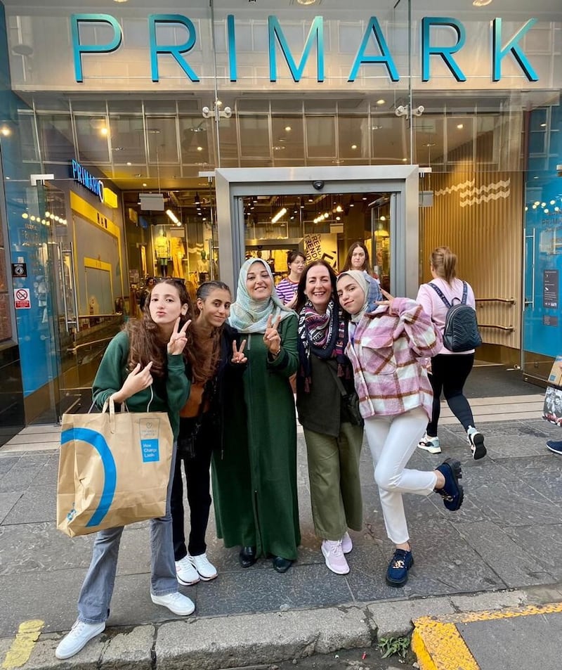 Pupils Yara, Malak, teacher Rinan (wearing green) and Rahaf shopping in Belfast last year. All of them have managed to make contact from Gaza, but said they are deeply afraid for their safety.