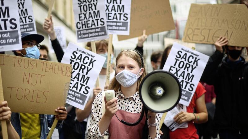 People take part in a protest outside the Department of Education in Westminster, London, over the government&#39;s handling of A-level results. Picture by Victoria Jones/PA Wire 
