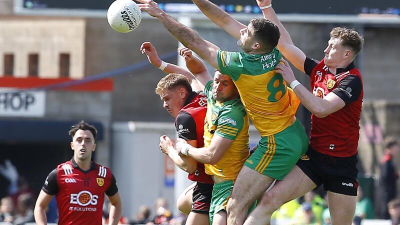 Down and Donegal players battle for possession during their Ulster Championship quarter-final clash at Pairc Esler. Picture by Philip Walsh
